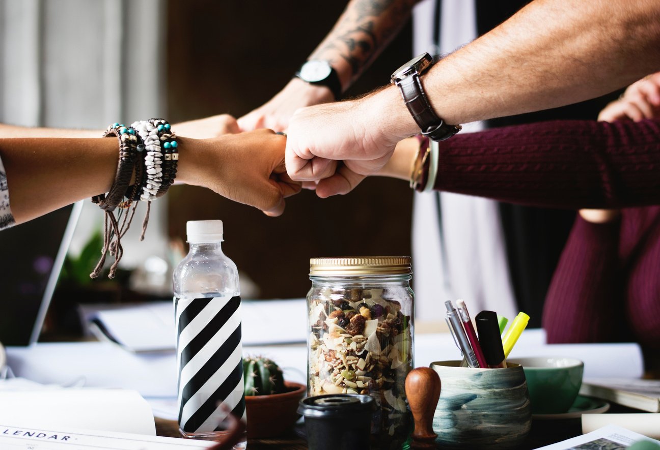 Group of Colleagues Doing Fist Bump